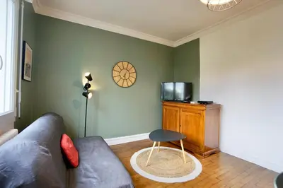 Télévision ou salle de divertissement dans l'établissement La Baie