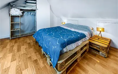 Un ou plusieurs lits dans un hébergement de l'établissement Amazing Home In Lannéanou With Wifi