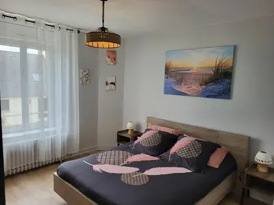 Un ou plusieurs lits dans un hébergement de l'établissement Appartement paisible en Baie de Morlaix Plougasnou