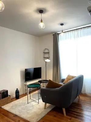Télévision ou salle de divertissement dans l'établissement Appartement en Centre-Ville