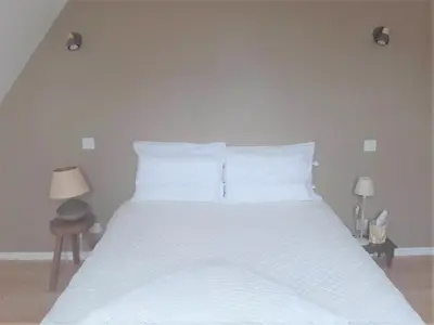 Un ou plusieurs lits dans un hébergement de l'établissement Dom & ses chambres d'hôtes