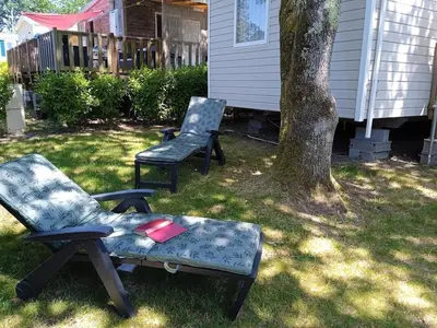 Jardin de l'établissement MOBIL-HOME TOUT CONFORT, 3 CHAMBRES, Domaine de Kerlann
