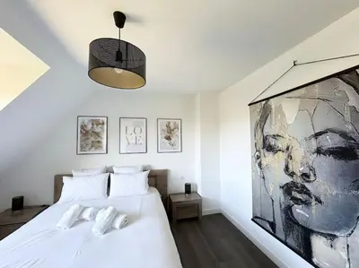 Un ou plusieurs lits dans un hébergement de l'établissement Belle maison rénovée à la plage
