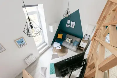 Télévision ou salle de divertissement dans l'établissement La Mouette Tranquille