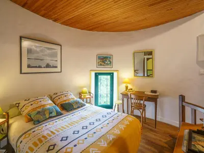 Un ou plusieurs lits dans un hébergement de l'établissement Holiday Home Le Pigeonnier by Interhome
