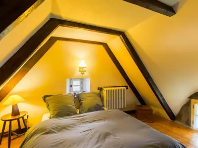 Un ou plusieurs lits dans un hébergement de l'établissement Holiday Home Chaumiere Natelliou by Interhome
