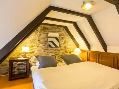 Un ou plusieurs lits dans un hébergement de l'établissement Holiday Home Chaumiere Natelliou by Interhome