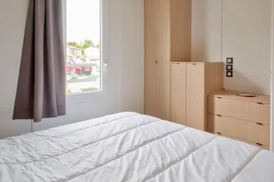 Un ou plusieurs lits dans un hébergement de l'établissement Chalet pour 4 - Résidence avec piscine