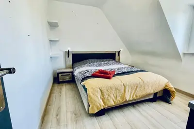 Un ou plusieurs lits dans un hébergement de l'établissement TI GLAS - La maison bleue