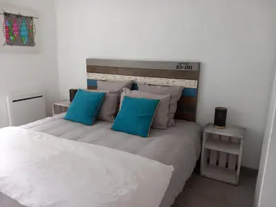 Un ou plusieurs lits dans un hébergement de l'établissement le loft de la riviéra