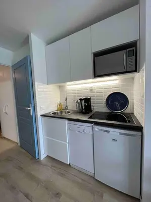 Cuisine ou kitchenette dans l'établissement CAP COZ Plage