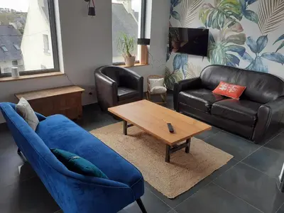 Coin salon dans l'établissement Maison avec vue mer 