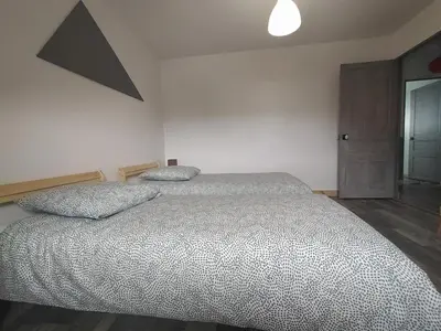 Un ou plusieurs lits dans un hébergement de l'établissement Appartement vue sur mer