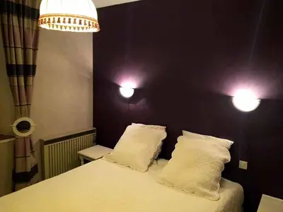 Un ou plusieurs lits dans un hébergement de l'établissement Villa Ropartz