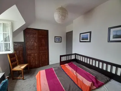 Un ou plusieurs lits dans un hébergement de l'établissement Maison de vacances à la plage
