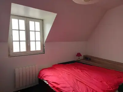 Un ou plusieurs lits dans un hébergement de l'établissement Maison de vacances à la plage