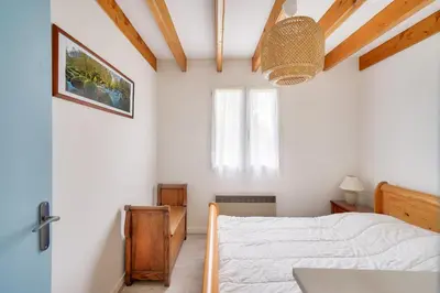 Un ou plusieurs lits dans un hébergement de l'établissement Plobannalec-Lesconil centre - Maison avec grand jardin