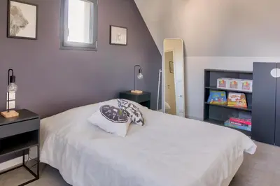 Un ou plusieurs lits dans un hébergement de l'établissement Maison moderne pour 8 - 300m plage de Pors Carn