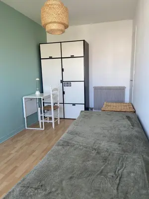 Un ou plusieurs lits dans un hébergement de l'établissement Appartement de ville et plage