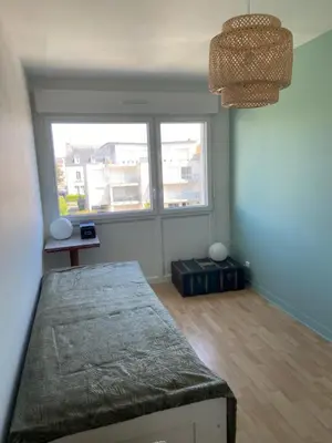 Un ou plusieurs lits dans un hébergement de l'établissement Appartement de ville et plage