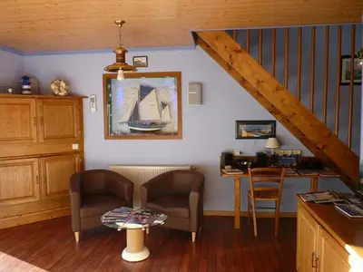 Coin salon dans l'établissement La Suite du Pêcheur balnéo et terrasse privative Entre terre et mer Chut le Bonheur y est caché !