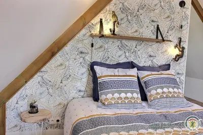 Un ou plusieurs lits dans un hébergement de l'établissement Chambre de kergomar