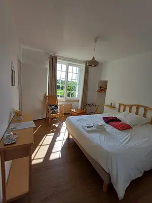 Un ou plusieurs lits dans un hébergement de l'établissement Ty Monde - Chambres d'hôtes en Finistère