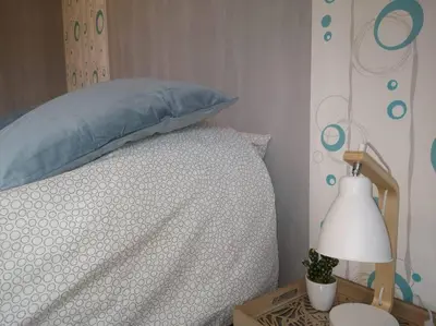 Un ou plusieurs lits dans un hébergement de l'établissement L'Escale - appartement spacieux au calme