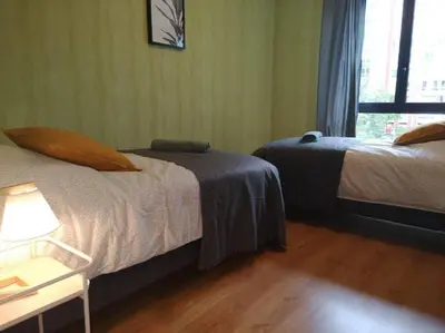 Un ou plusieurs lits dans un hébergement de l'établissement L'Escale - appartement spacieux au calme