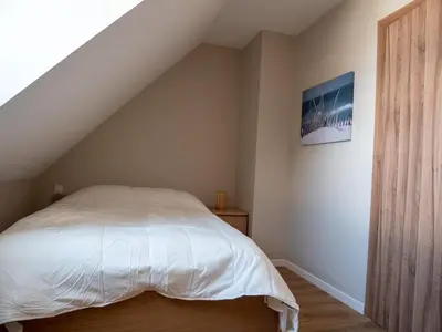 Un ou plusieurs lits dans un hébergement de l'établissement Ker est, Surf House, plage de Pors Carn à pieds