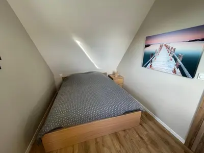 Un ou plusieurs lits dans un hébergement de l'établissement Ker est, Surf House, plage de Pors Carn à pieds