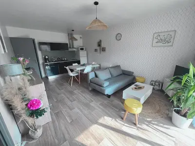 Coin salon dans l'établissement Très bel appartement proche de la mer