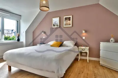 Un ou plusieurs lits dans un hébergement de l'établissement LocaLise - M3C - La petite Bigoudène - Maison entièrement rénovée en duplex avec jardin - Tout à pied, plage, port, centre, commerces - Wifi inclus - Draps inclus - Animaux bienvenus