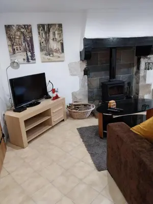 Télévision ou salle de divertissement dans l'établissement Gite Albert