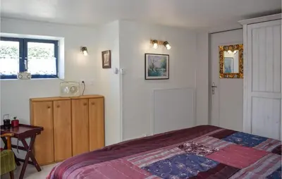 Un ou plusieurs lits dans un hébergement de l'établissement Belle Maison 450 M De La Plage