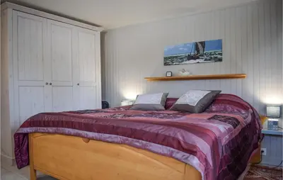 Un ou plusieurs lits dans un hébergement de l'établissement Belle Maison 450 M De La Plage