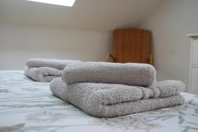 Un ou plusieurs lits dans un hébergement de l'établissement Appartement vue mer exposé sud à Carantec