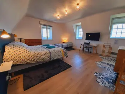 Un ou plusieurs lits dans un hébergement de l'établissement La Bonne Etoile - Chambres d'hôtes et Appartements -