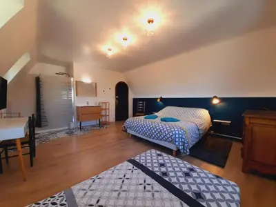 Un ou plusieurs lits dans un hébergement de l'établissement La Bonne Etoile - Chambres d'hôtes et Appartements -
