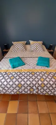 Un ou plusieurs lits dans un hébergement de l'établissement La Bonne Etoile - Chambres d'hôtes et Appartements -