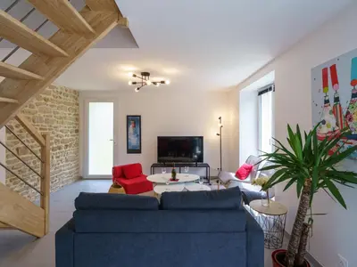 Télévision ou salle de divertissement dans l'établissement Holiday Home Penhors by Interhome