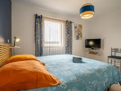 Un ou plusieurs lits dans un hébergement de l'établissement Holiday Home Les Agapanthes by Interhome