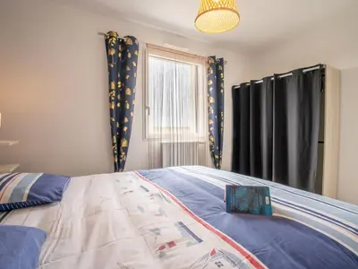 Un ou plusieurs lits dans un hébergement de l'établissement Holiday Home Les Agapanthes by Interhome