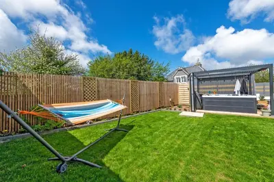 Jardin de l'établissement Maison spacieuse avec spa , sauna au pays des Abers ,10 min des plages Bretagne