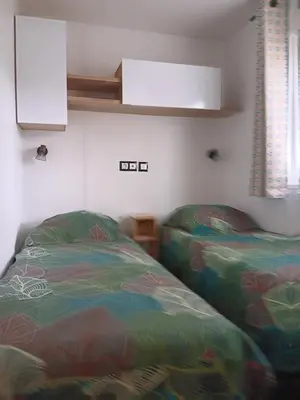 Un ou plusieurs lits dans un hébergement de l'établissement pont aven mobile hom