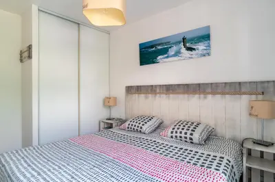 Un ou plusieurs lits dans un hébergement de l'établissement Le Kichen - Appt proche de la plage