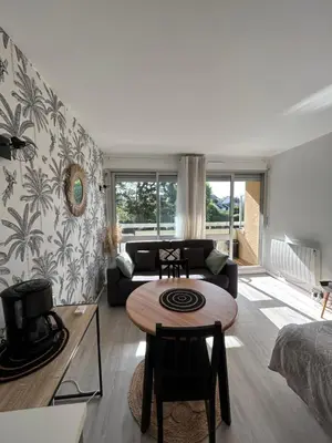 Un ou plusieurs lits dans un hébergement de l'établissement Le Lagon, joli studio en bord de mer