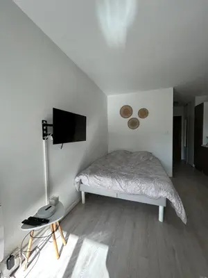 Un ou plusieurs lits dans un hébergement de l'établissement Le Lagon, joli studio en bord de mer