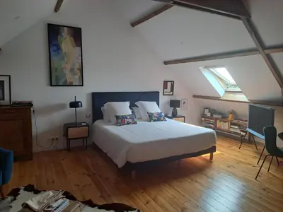 Un ou plusieurs lits dans un hébergement de l'établissement Wanatan Chambre Deluxe