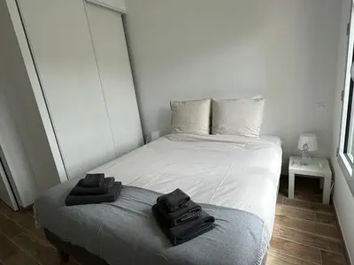 Un ou plusieurs lits dans un hébergement de l'établissement Appartement Design X - Hyper Centre - Parking Privé - Terrasse Plein Sud Quimper
